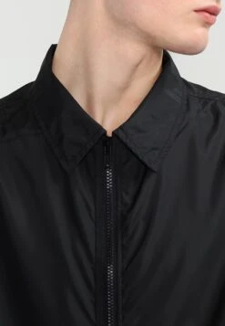 URBAN CLASSICS Coach Coat - Trenchcoat - Black -Urban Classics 09034012306348b0ac5b16922c007775